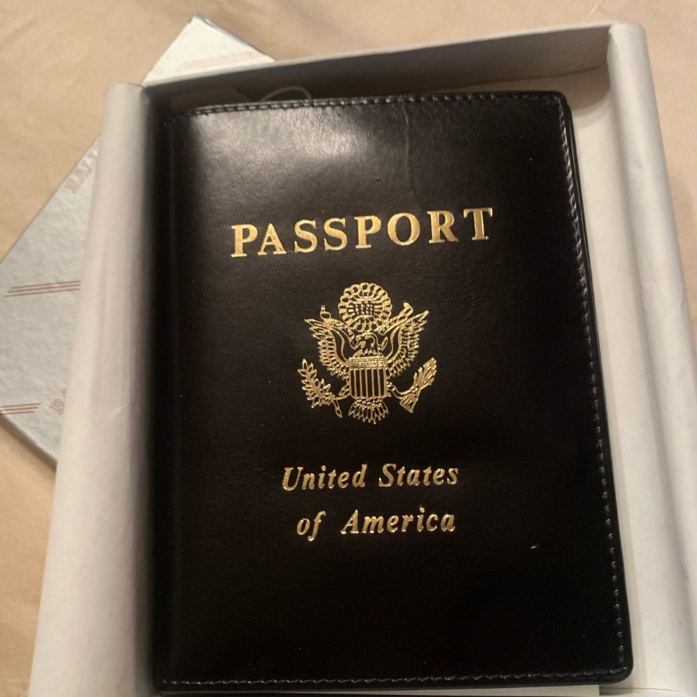 Black leather passport case by Bally.
